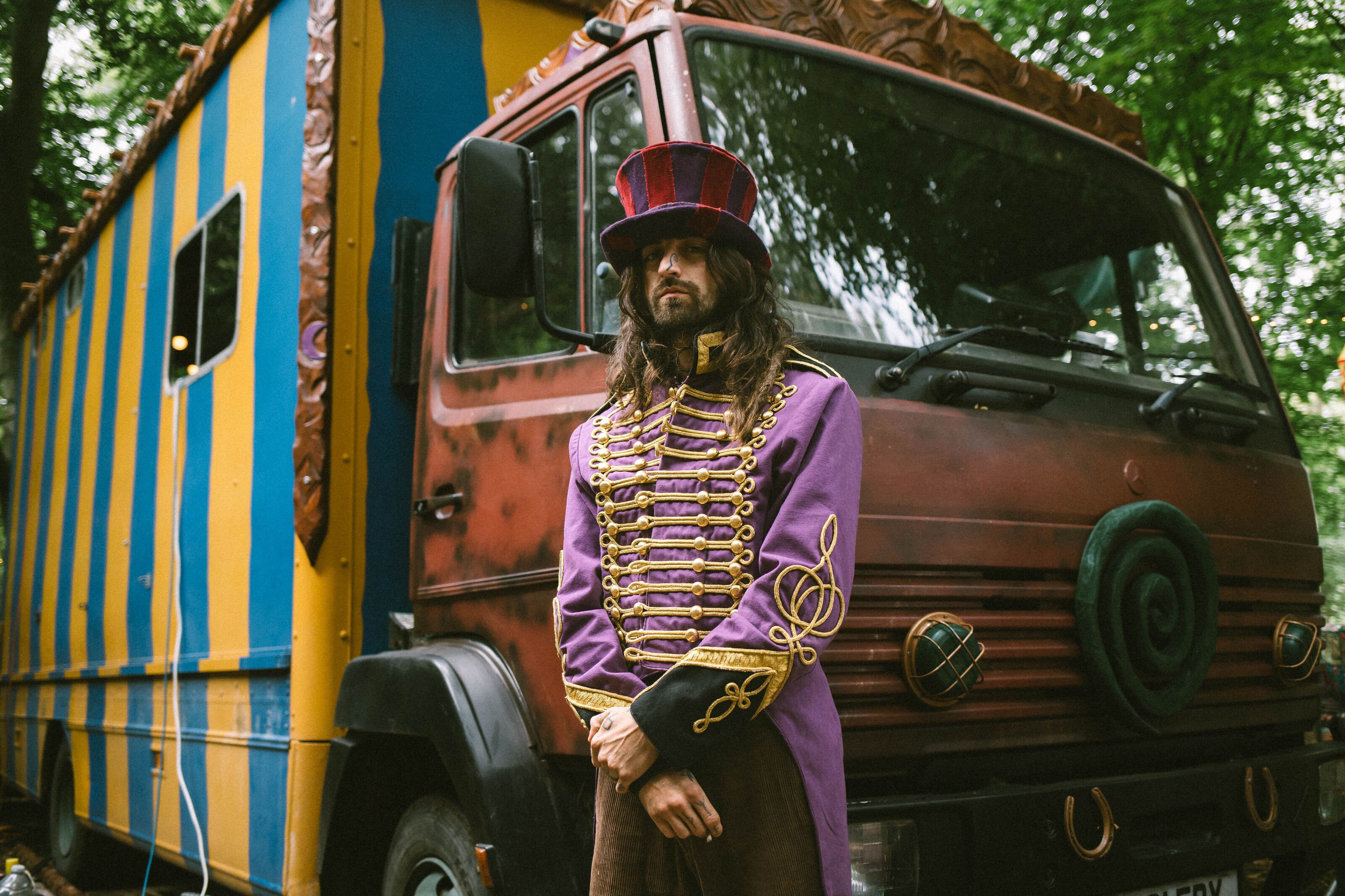 Cam Cole standing in front of his bus