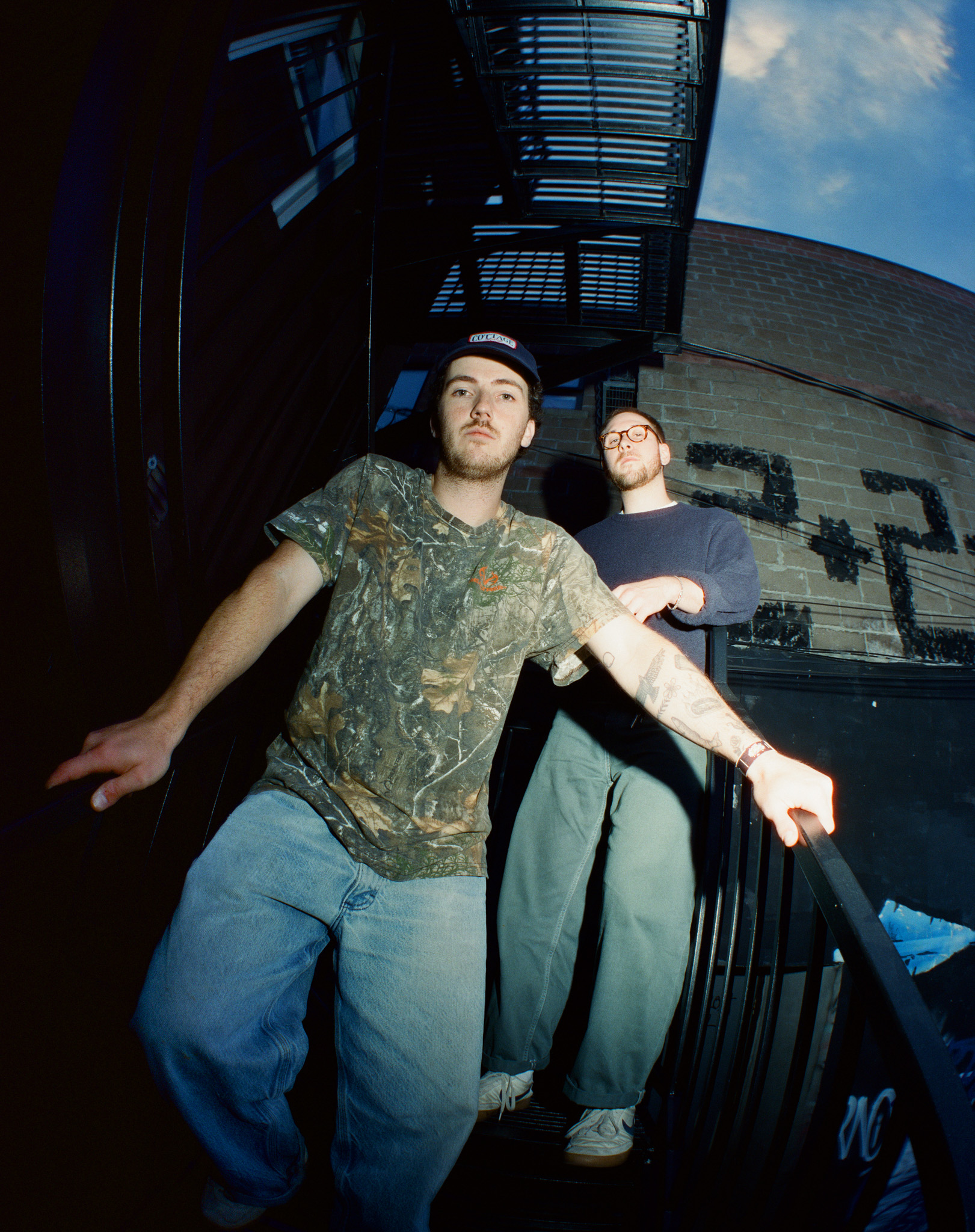 cleopatrick’s Luke Gruntz and Ian Fraser on an outdoor staircase, photographed by Andrew Wu